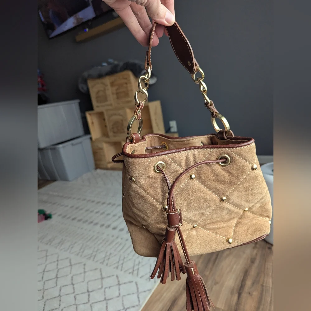 Claudia Firenze Leather Bucket Bag With Pull Top And Tassels.